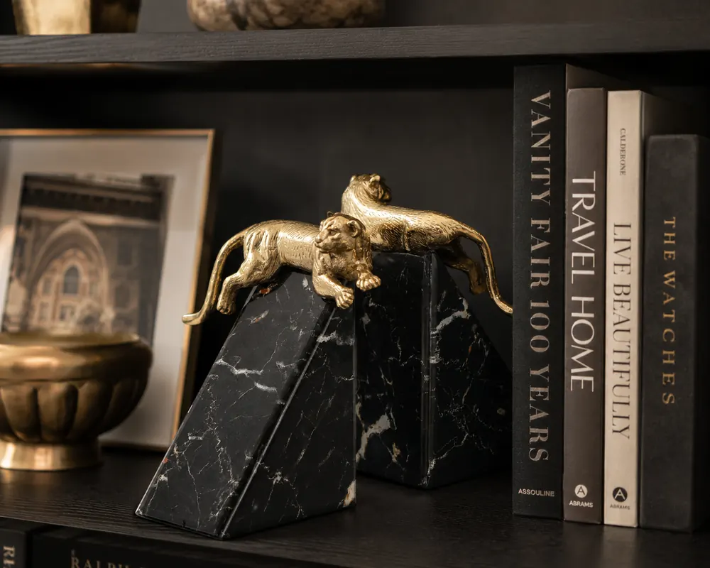 Leopard bookend on black marble glass